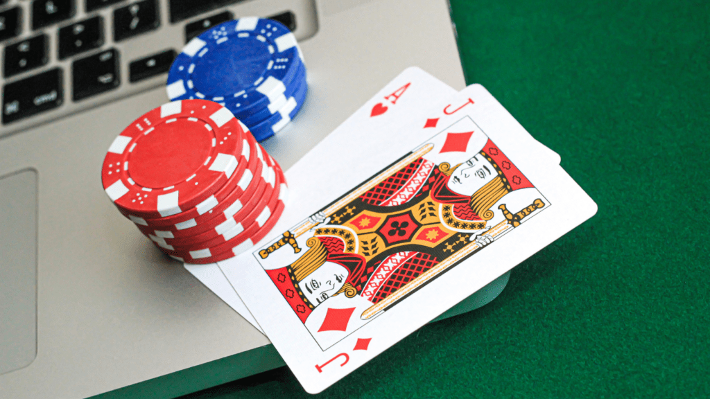 Laptop ,Playing cards and casino chips