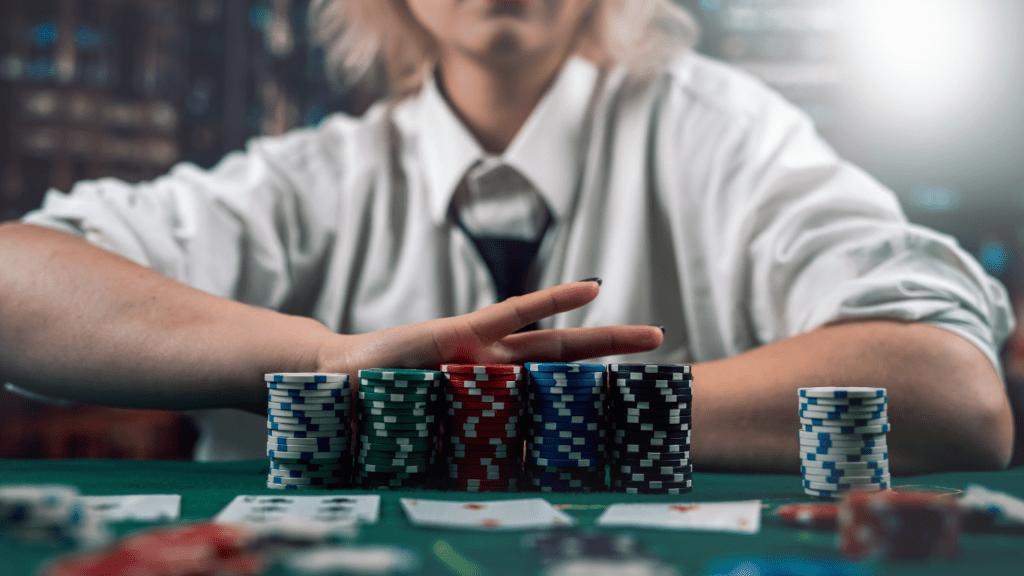 Casino chips and playing cards in front of a Woman